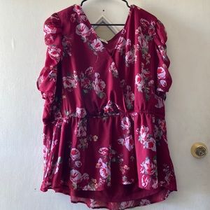 Wine colored blouse.
